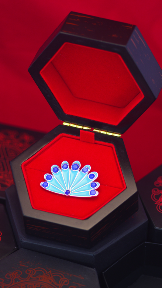 Broche camouflage paon miraculeuse